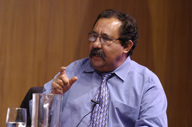 Photo of Raul Grijalva in a purple shirt and speaking