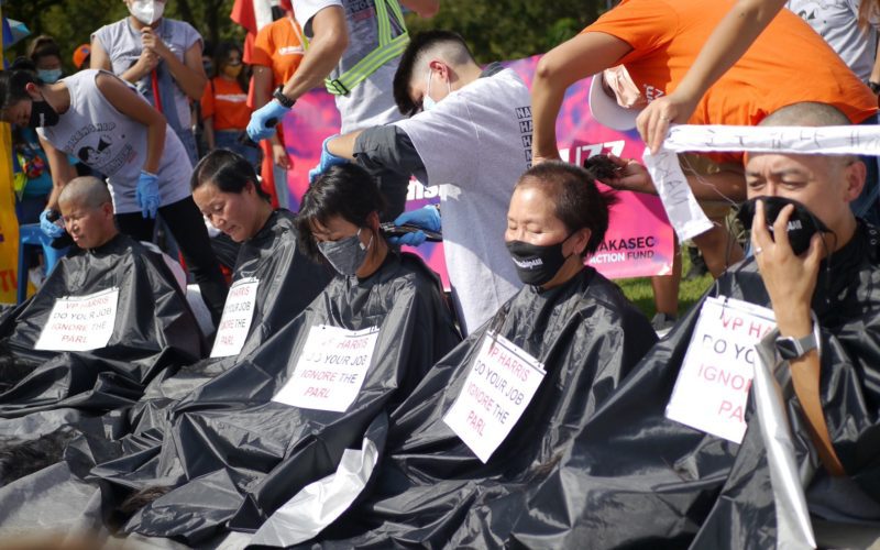 Executive directors from AAPI immigration rights groups shave their heads at an event in Washington, D.C. on October 5, 2021. Photo courtesy of the NAKASEC Action Fund.