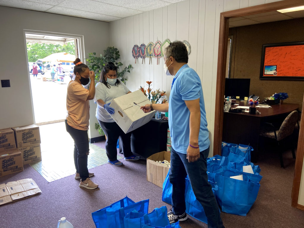 Photo of Marshallese Education Initiative workers preparing boxes for delivery