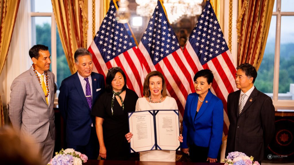Photo of Nancy Pelosi, Mark Takano, Judy Chu, Ted Lieu and Grace Meng standing at the enrollment ceremony for Meng's AAPI history museum bill