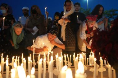 Photo of Sikh mourners lighting candles after a vigil marking the tenth anniversary of the deadly attack at the Sikh Temple in Oak Creek, Wisconsin on August 5, 2022. Photo courtesy of the Sikh Coalition.
