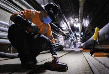 A Naval Facilities Engineering Systems Command contractor prepares to install monitors to detect petroleum contamination in the Red Hill Well. Photo courtesy of the U.S. Navy.
