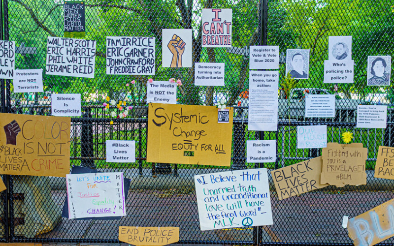 Photo showing signs rallying around Blasian solidarity