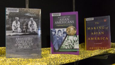 Photo of three AAPI-related books showcased on a table