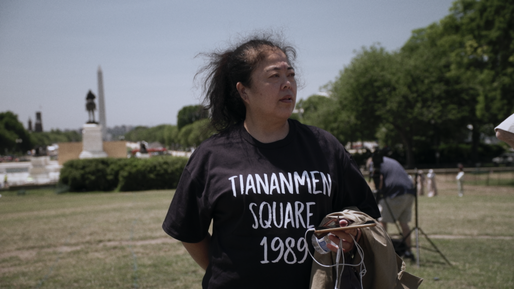 Photo of Chinese dissident Chunyan Wang wearing a shirt that says "Tiananmen Square 1989"