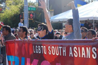 Photo of South Asians in Atlanta, Georgia carrying a sign in support of LGBTQ rights
