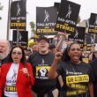 Photo of Jodi Long marching with other SAG-AFTRA union members on strike