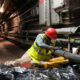 A contractor applies a protective coating of paint to a pipe inside the Red Hill Bulk Fuel Storage Facility in Honolulu, Aug. 14, 2026. Photo: U.S. Navy